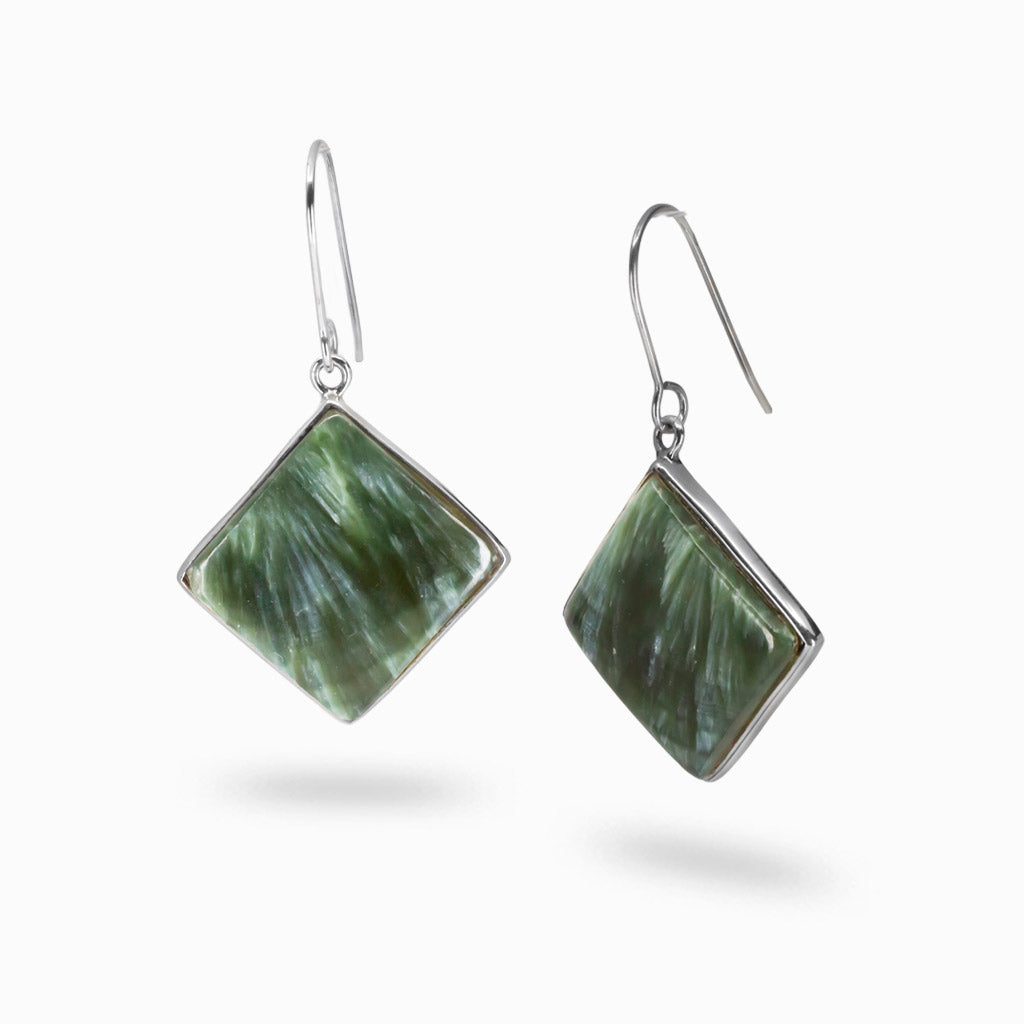 Diamond-shaped Seraphinite cabochon earrings in sterling silver with green and silver feather-like patterns. | MADE IN EARTH