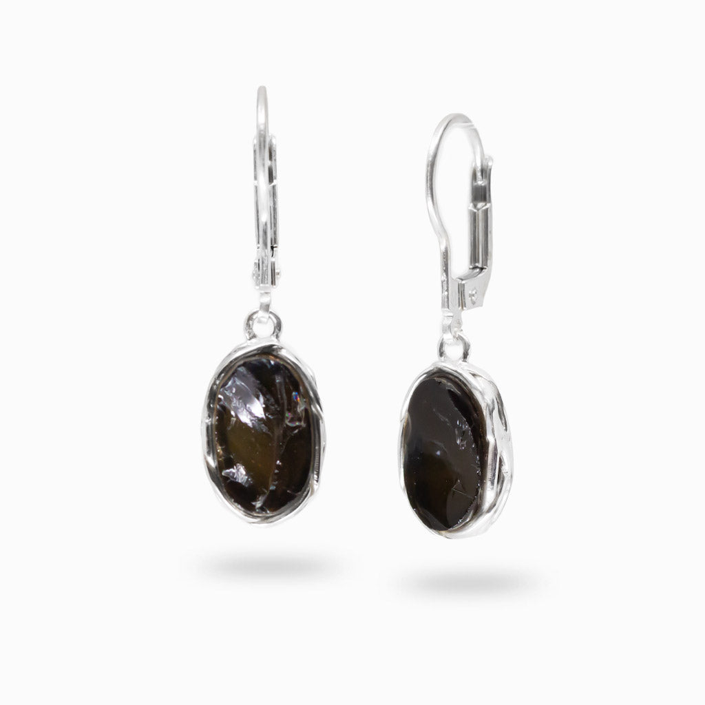 Apache obsidian oval bezel earrings in sterling silver. Smooth black gemstone studs with subtle translucency for a minimal, elegant look.