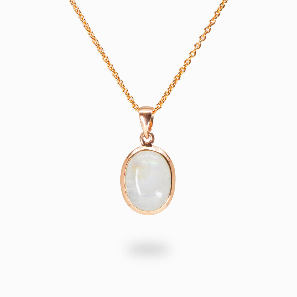 Oval cabochon Rainbow Moonstone pendant necklace in rose gold vermeil over sterling silver.