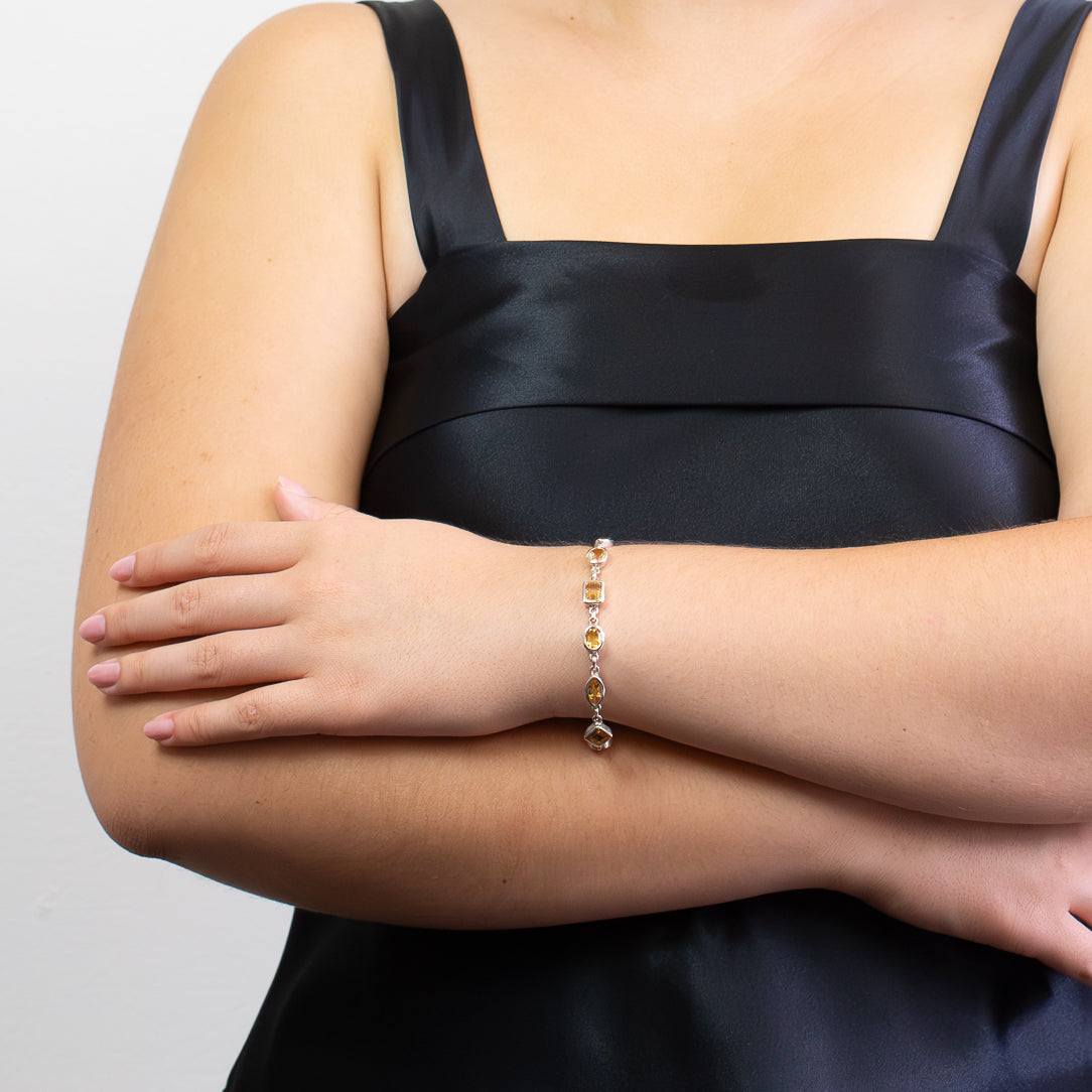 Faceted Citrine bracelet in sterling silver with assorted gemstone shapes.