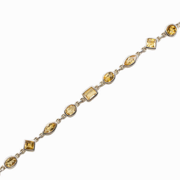 Faceted Citrine bracelet in sterling silver with assorted gemstone shapes.