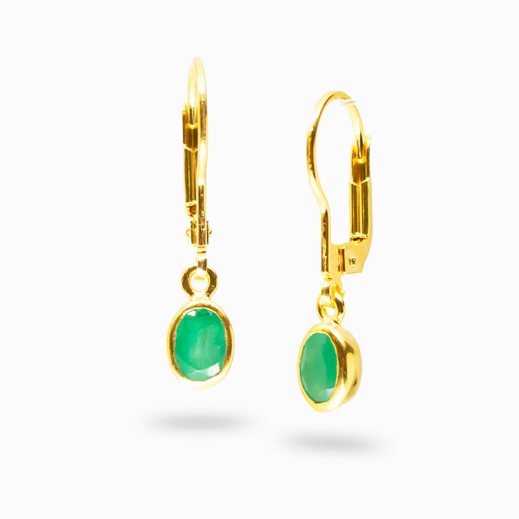 Faceted emerald oval drop earrings in yellow gold vermeil with vibrant green gemstone and polished finish