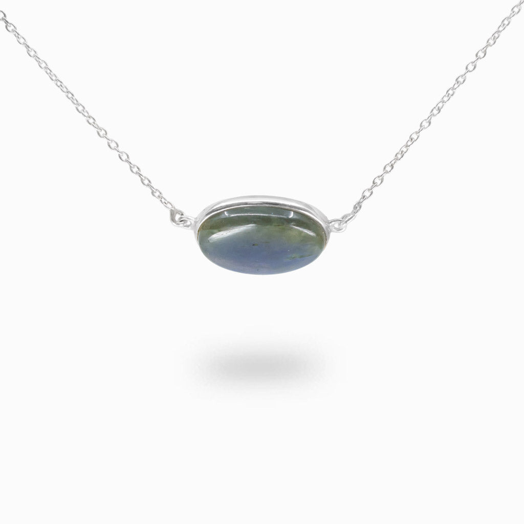 Labradorite necklace in sterling silver featuring a polished oval cabochon with natural iridescent flash.