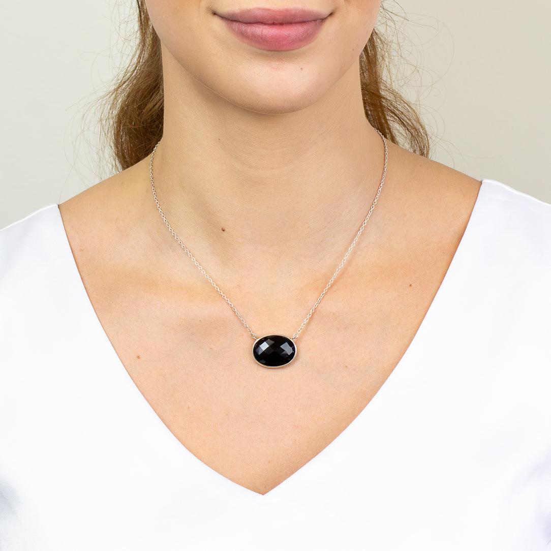 Faceted Black Onyx necklace in sterling silver with oval gemstone.