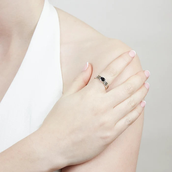 Oval Black Onyx gemstone bezel set in polished sterling silver triple-band ring.
