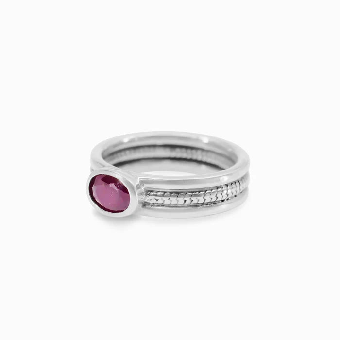 Oval Ruby gemstone bezel set in textured sterling silver triple-band ring.