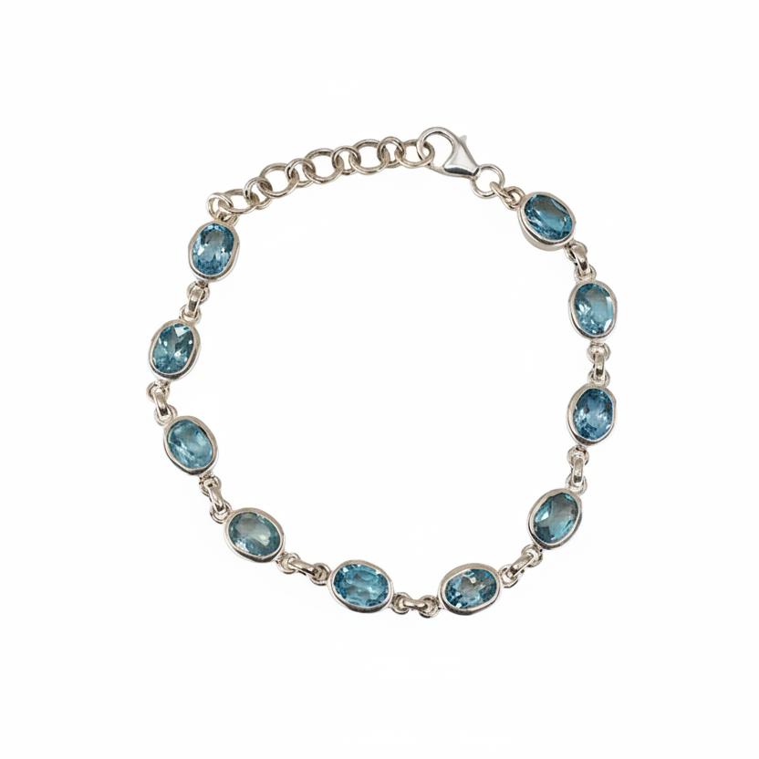 Faceted blue topaz bracelet with light blue gemstones in sterling silver