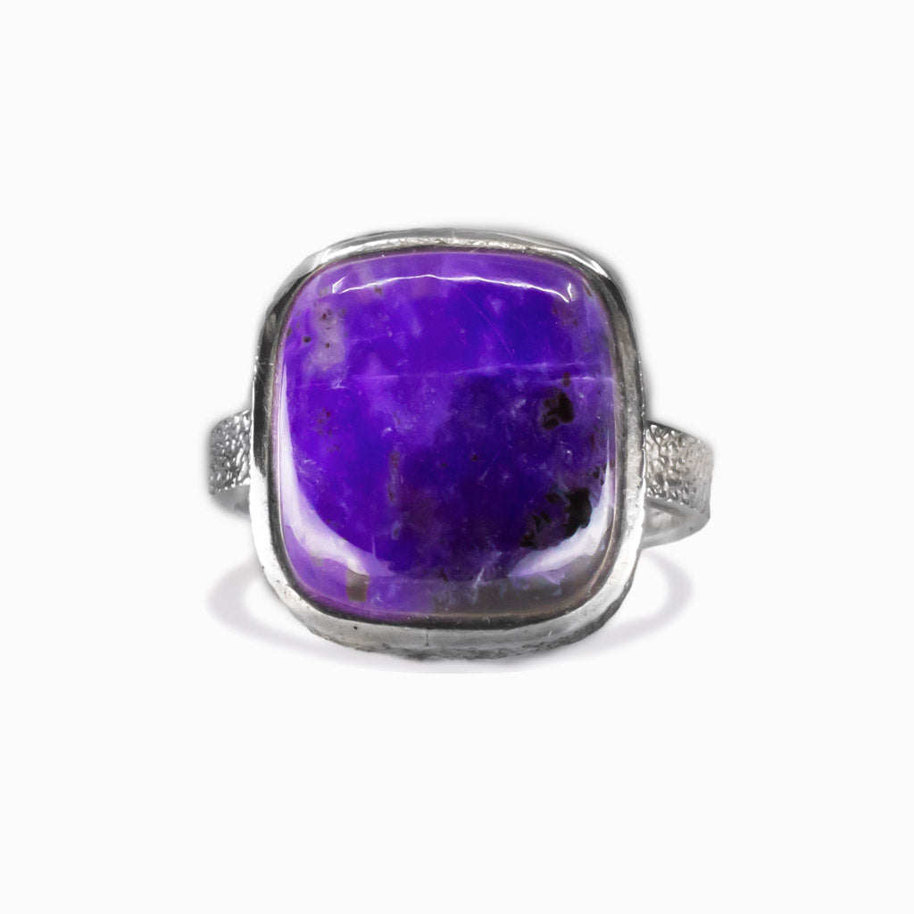 Square purple Sugilite cabochon ring set in sterling silver bezel with textured band. MADE IN EARTH
