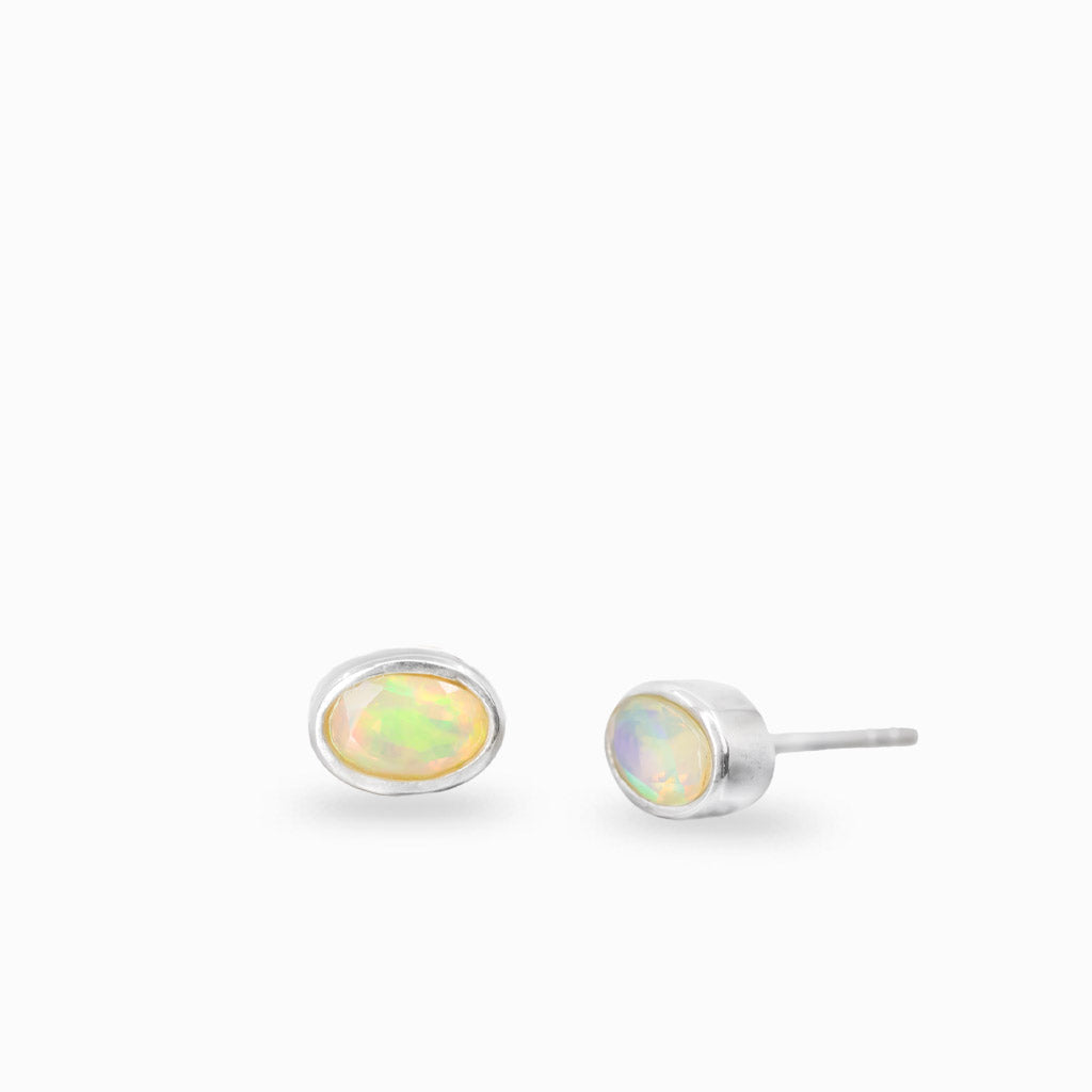 Faceted oval precious opal stud earrings in sterling silver