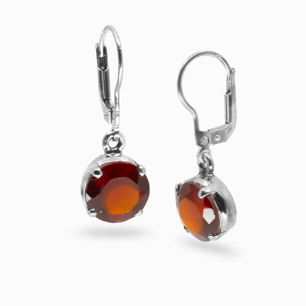Faceted round Garnet drop earrings in sterling silver featuring deep red gemstones with high brilliance. |MADE IN EARTH