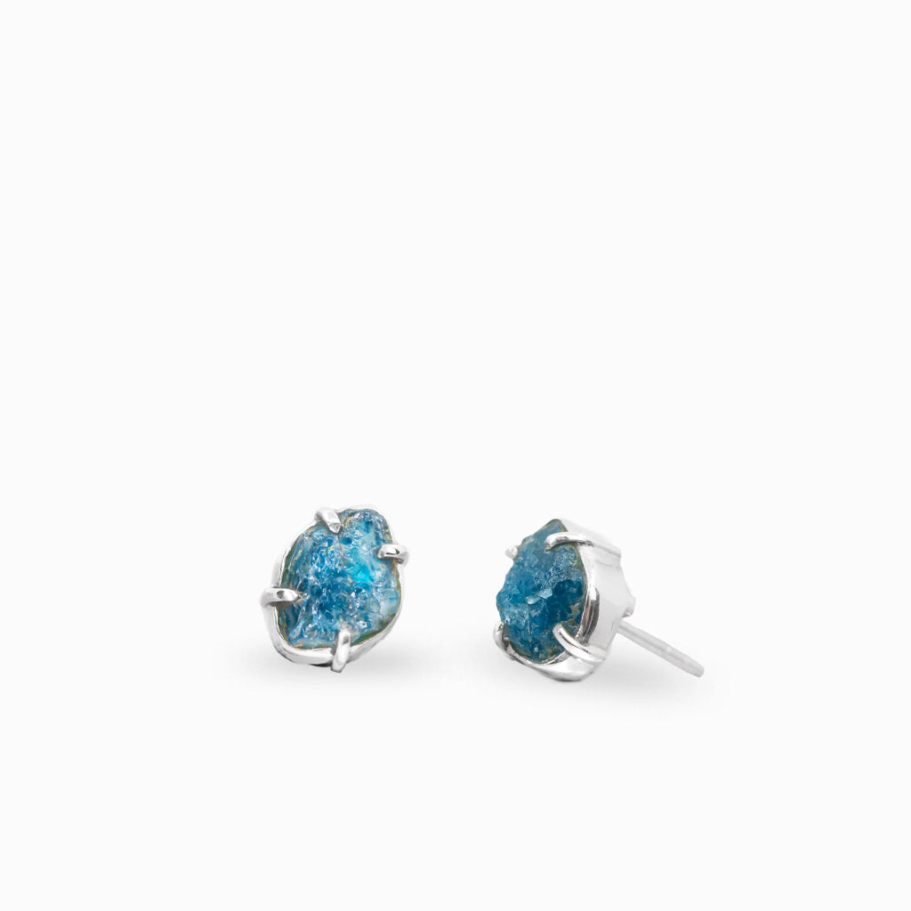 Sterling silver raw apatite stud earrings with vibrant natural blue crystal gemstones.
