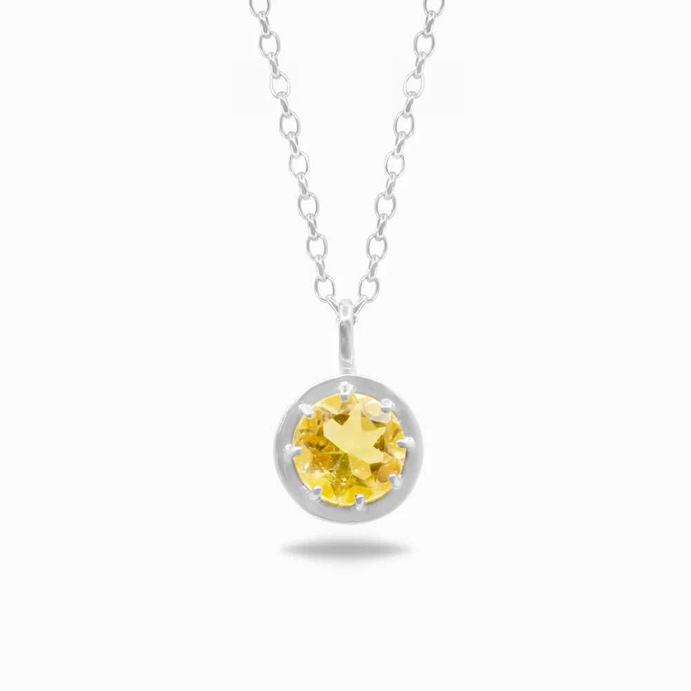 Round faceted golden-yellow Citrine gemstone set in polished sterling silver pendant necklace.