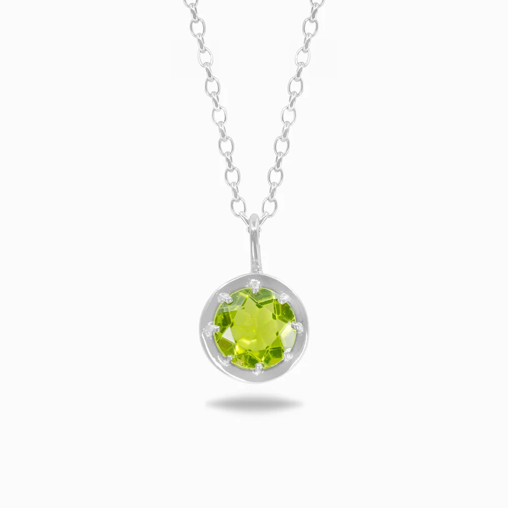 Round faceted bright green Peridot gemstone set in polished sterling silver pendant necklace.