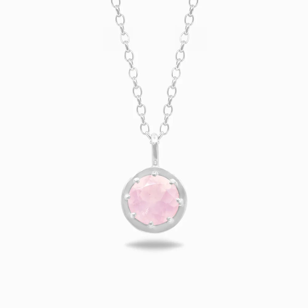 Round faceted pink Rose Quartz gemstone set in polished sterling silver pendant necklace.
