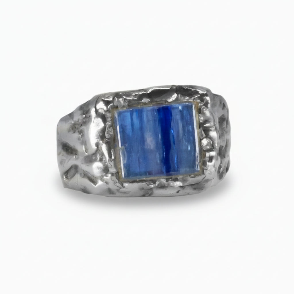Rectangular Kyanite cabochon ring in textured sterling silver band with deep blue gemstone. | MADE IN EARTH