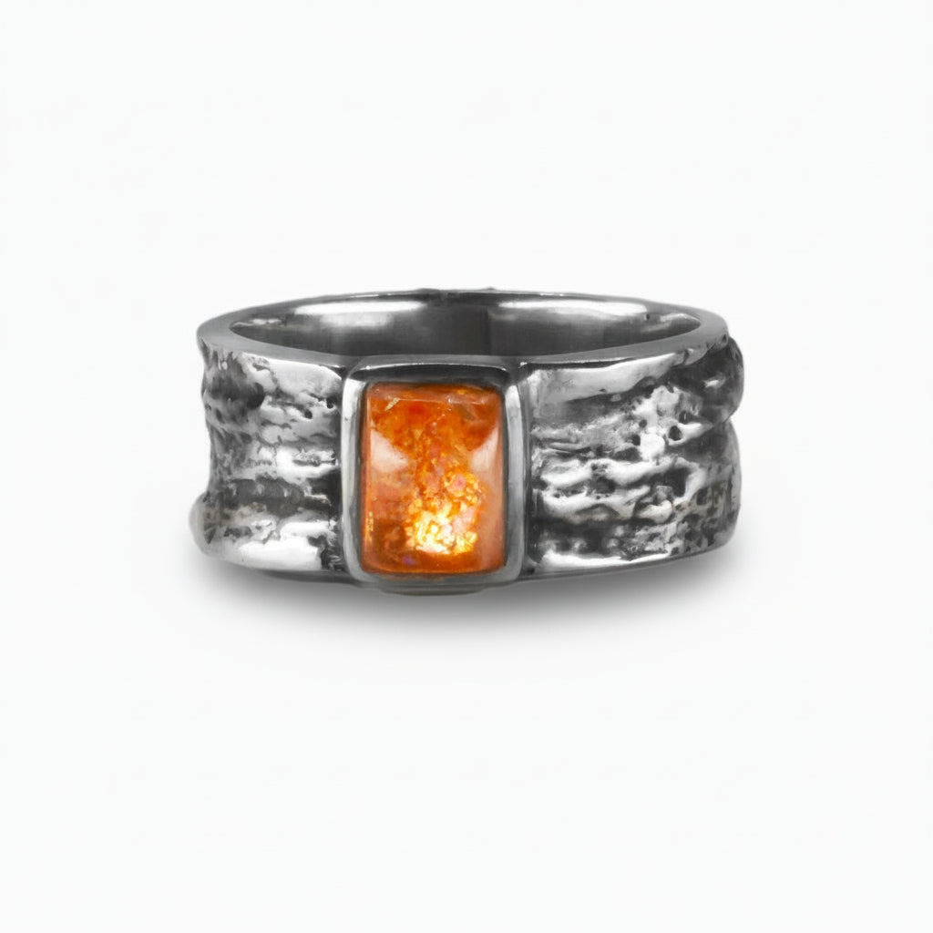 Rectangular Sunstone cabochon ring in textured sterling silver with glowing orange gemstone. | MADE IN EARTH