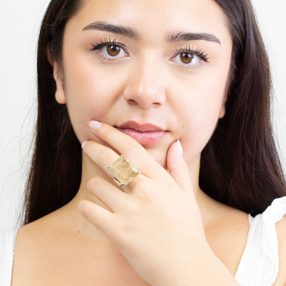 Rectangular faceted golden rutilated quartz ring set in sterling silver with golden rutile threads. MADE IN EARTH