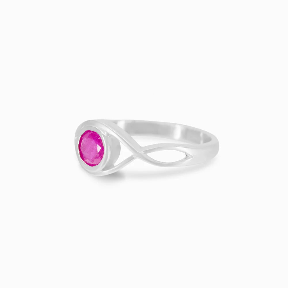Round faceted pink-red Ruby gemstone in polished sterling silver eye design ring.