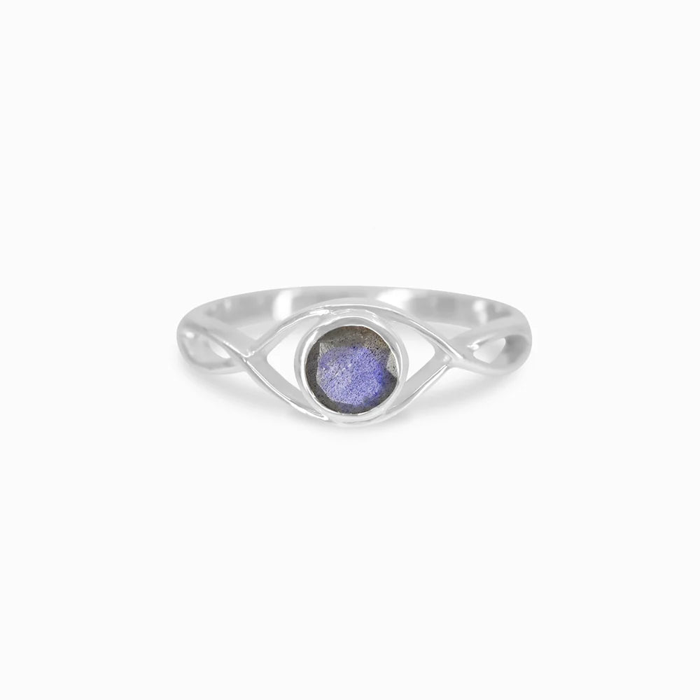 Round faceted Labradorite gemstone in polished sterling silver eye design ring.