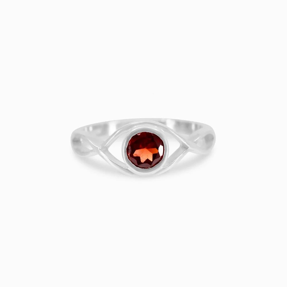 Round faceted deep red Garnet gemstone in polished sterling silver eye design ring.