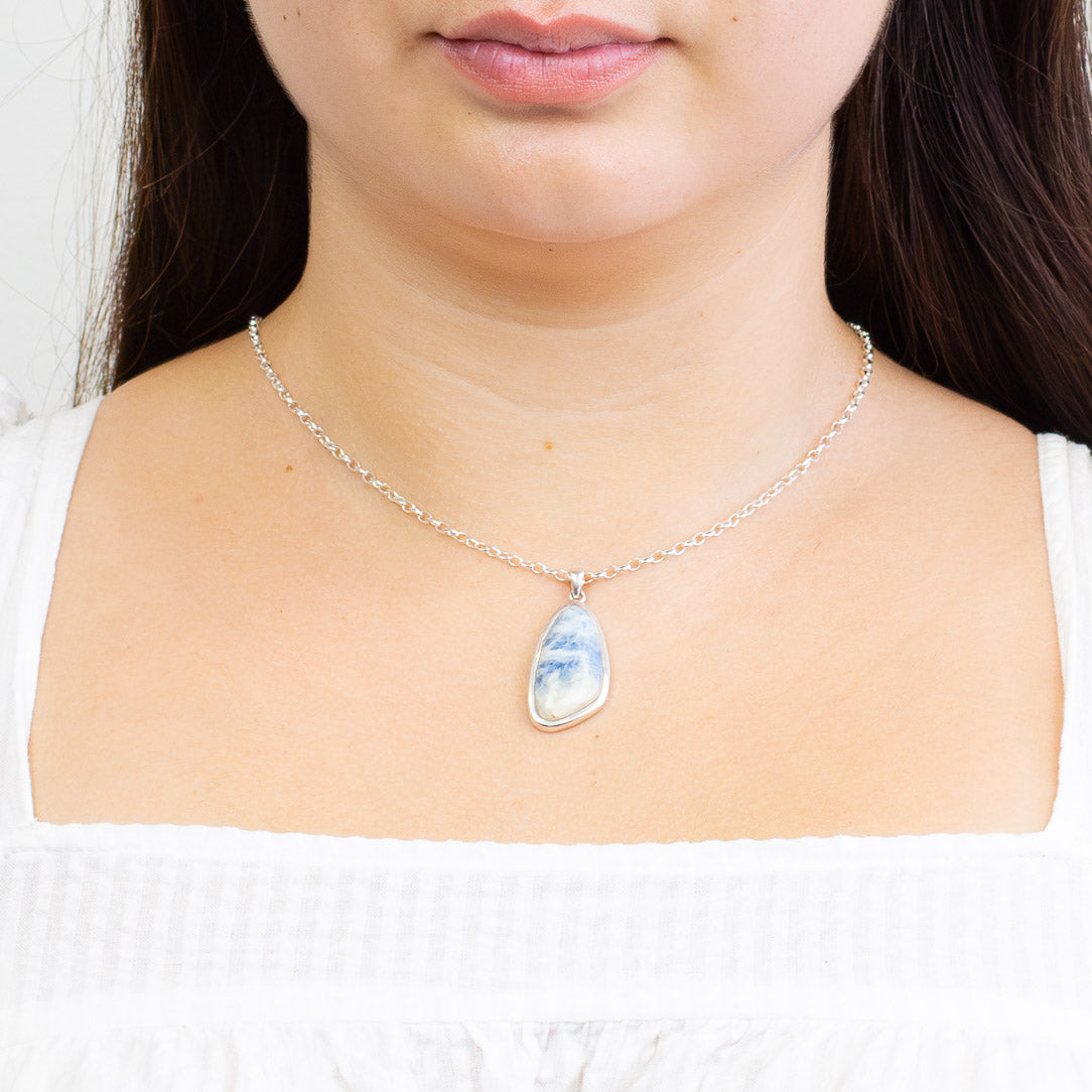 Blue Scheelite necklace in sterling silver with soft ocean blue and white layered cabochon stone. | MADE IN EARTH 