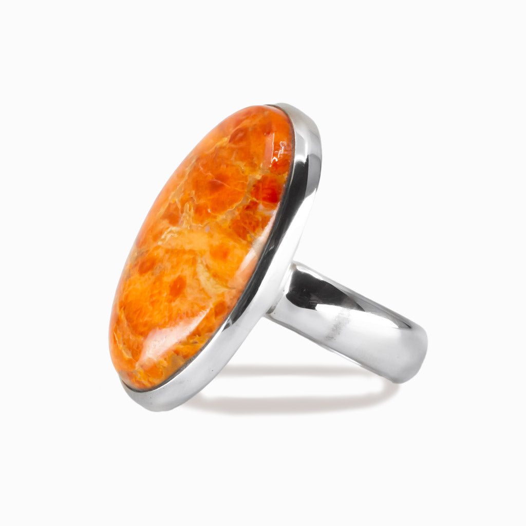 Oval sponge coral cabochon ring set in sterling silver with orange coral gemstone. MADE IN EARTH