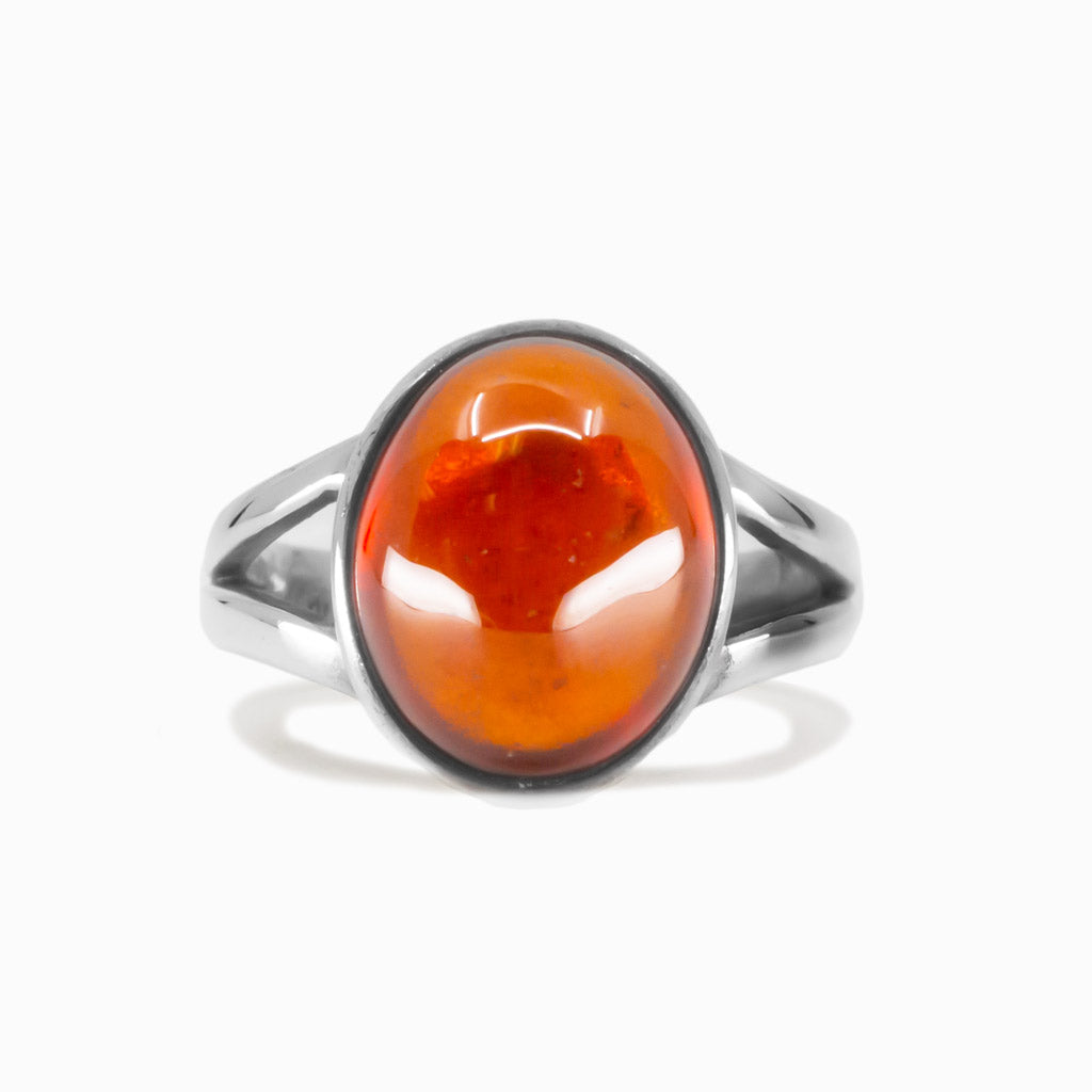 Oval hessonite garnet cabochon ring set in sterling silver with orange gemstone. MADE IN EARTH