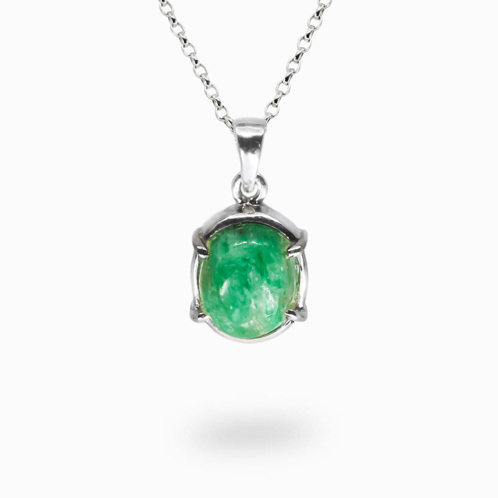 Cabochon emerald pendant in a sterling silver claw setting on a fine chain. | MADE IN EARTH