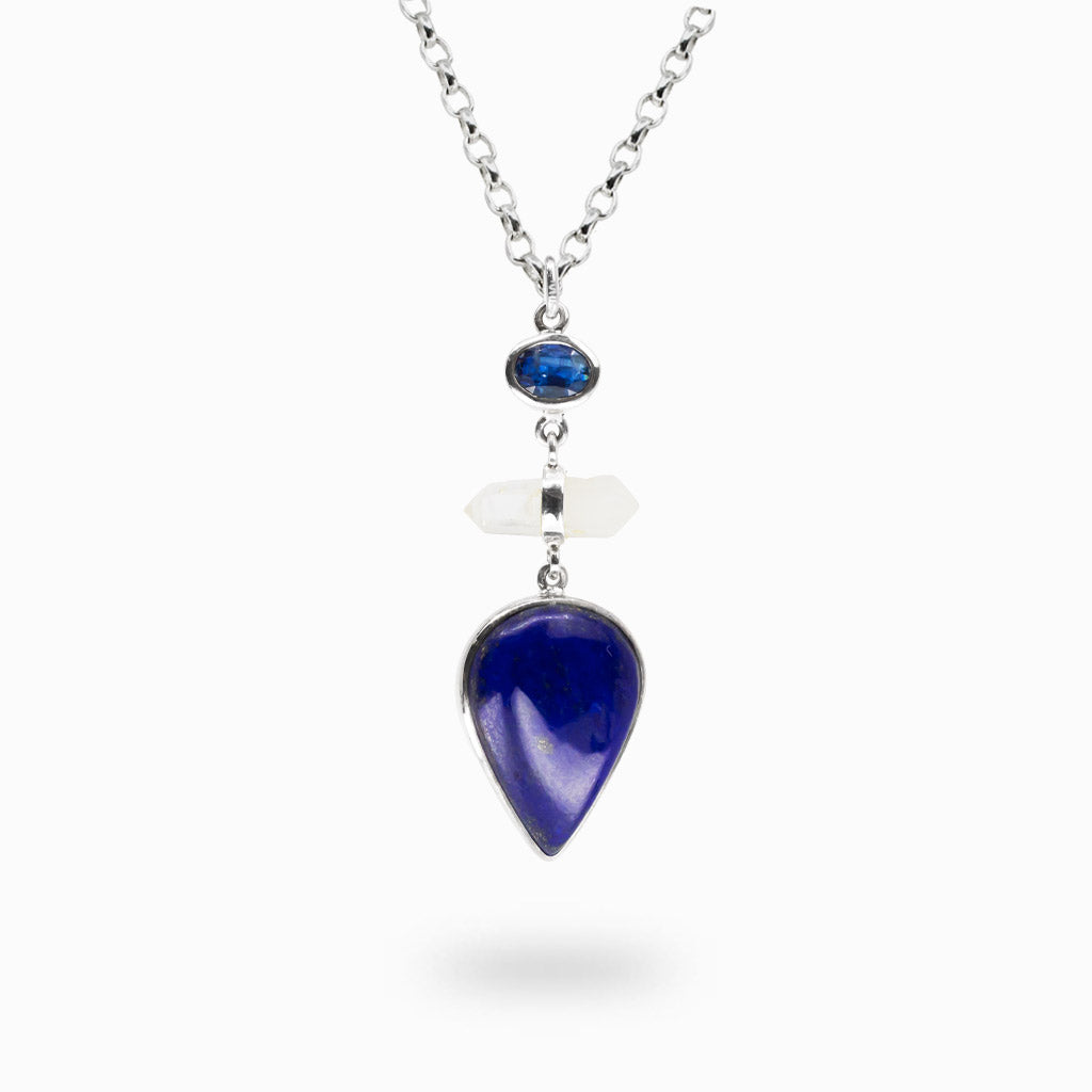 Sterling silver necklace featuring a pear-shaped Lapis Lazuli gemstone accented with blue Kyanite and double terminated Quartz crystal.