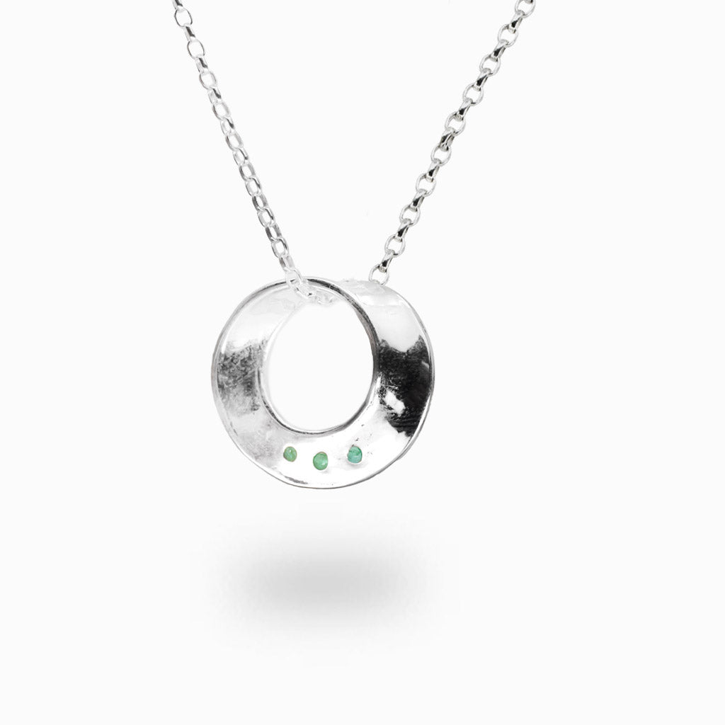 Sterling silver circle necklace with three emerald accents