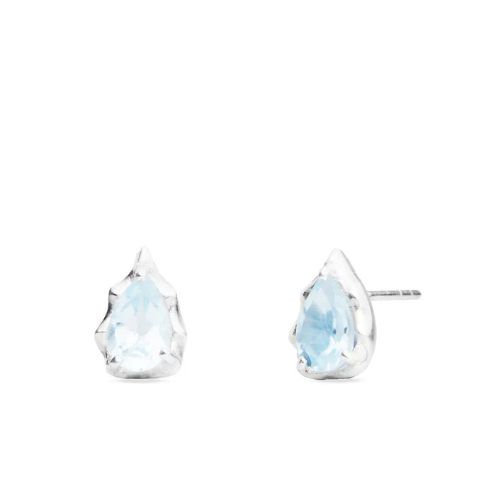 Teardrop faceted Blue Topaz gemstones prong set in polished sterling silver stud earrings.