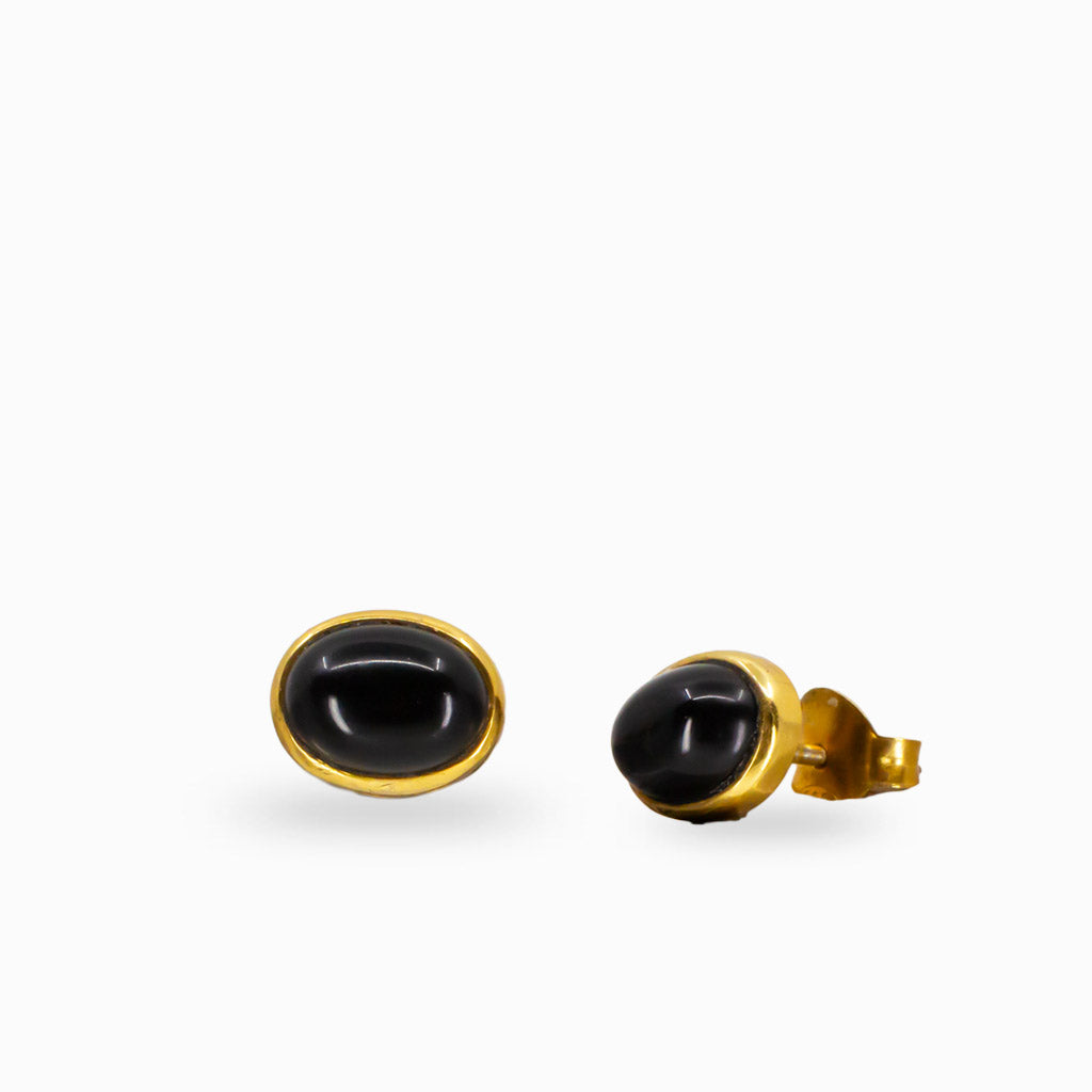 Pair of gold earrings with black onyx on a white background | MADE IN EARTH