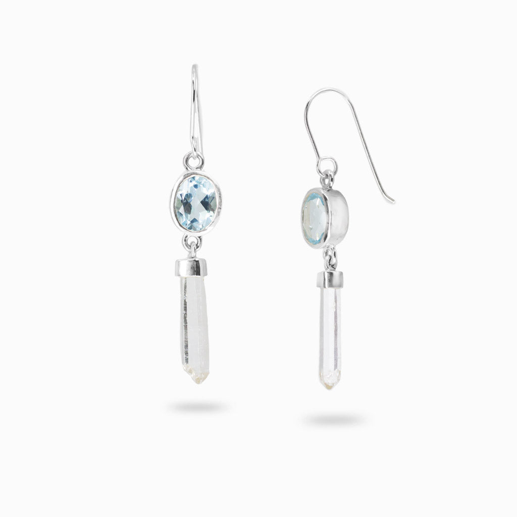Sterling silver drop earrings featuring faceted oval Blue Topaz with natural Laser Quartz crystal points.