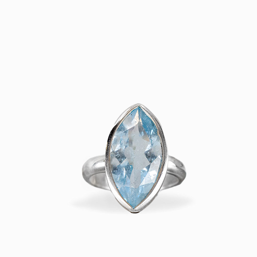 Marquise-cut Blue Topaz ring with faceted pale sky-blue gemstone, polished sterling silver bezel setting, and smooth band.