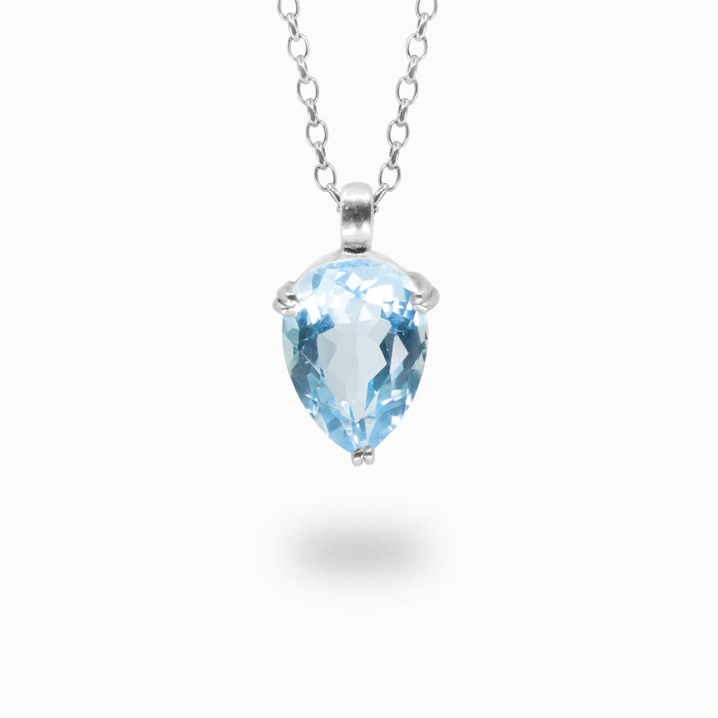 Fceted blue topaz claw necklace