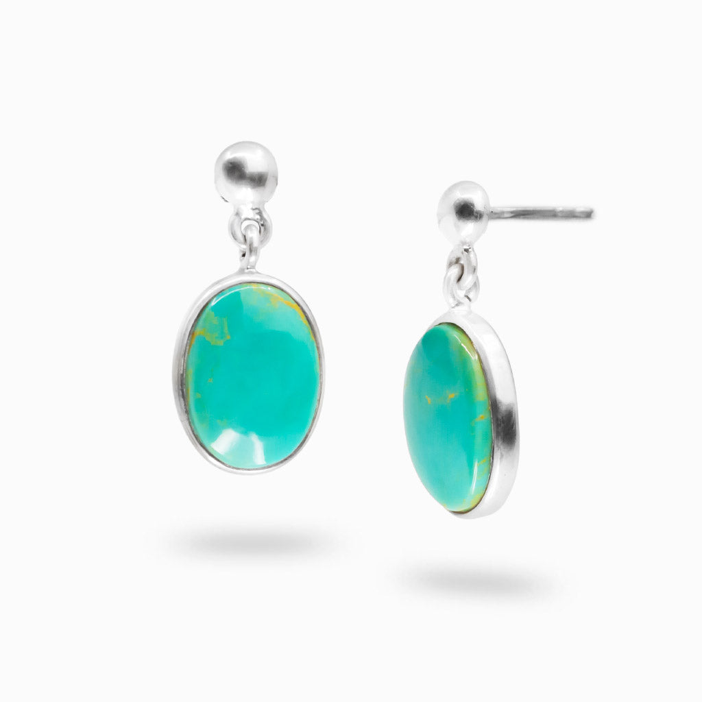 Sterling silver stud drop earrings featuring oval Campo Frio turquoise cabochons.