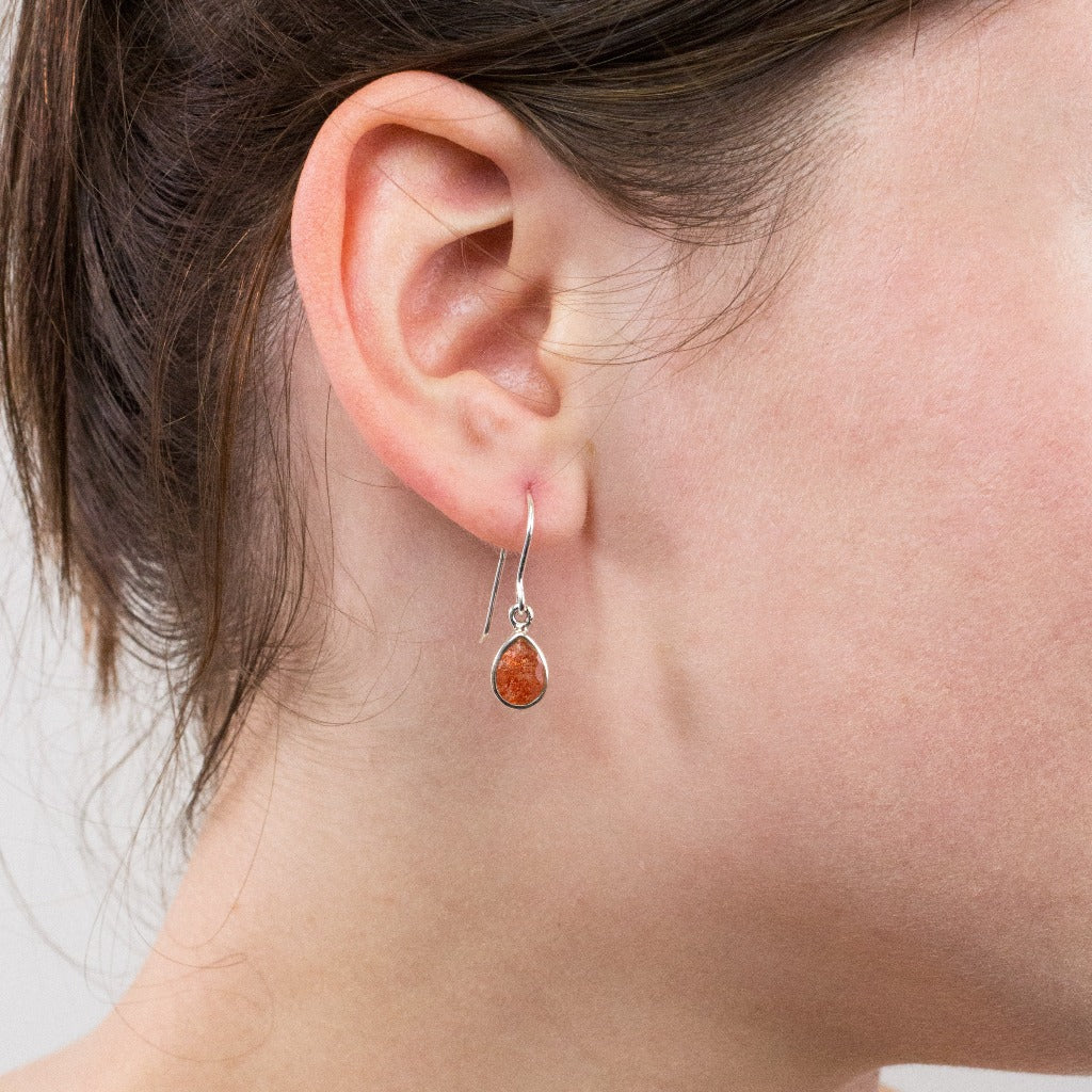 Sunstone drop earrings on model