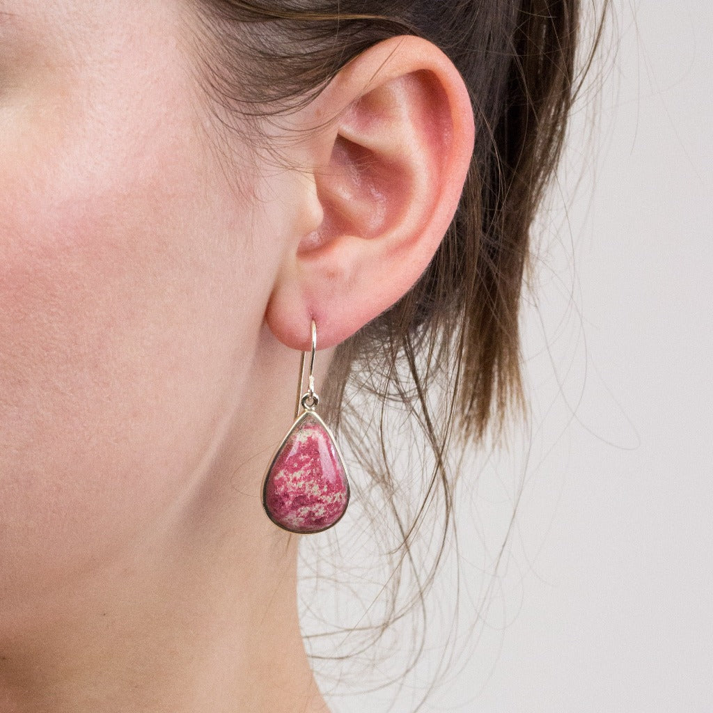 Thulite drop earrings on model