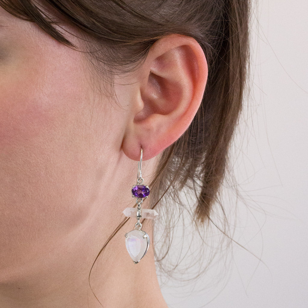Amethyst, Laser Quartz, and Rainbow Moonstone drop earrings on model
