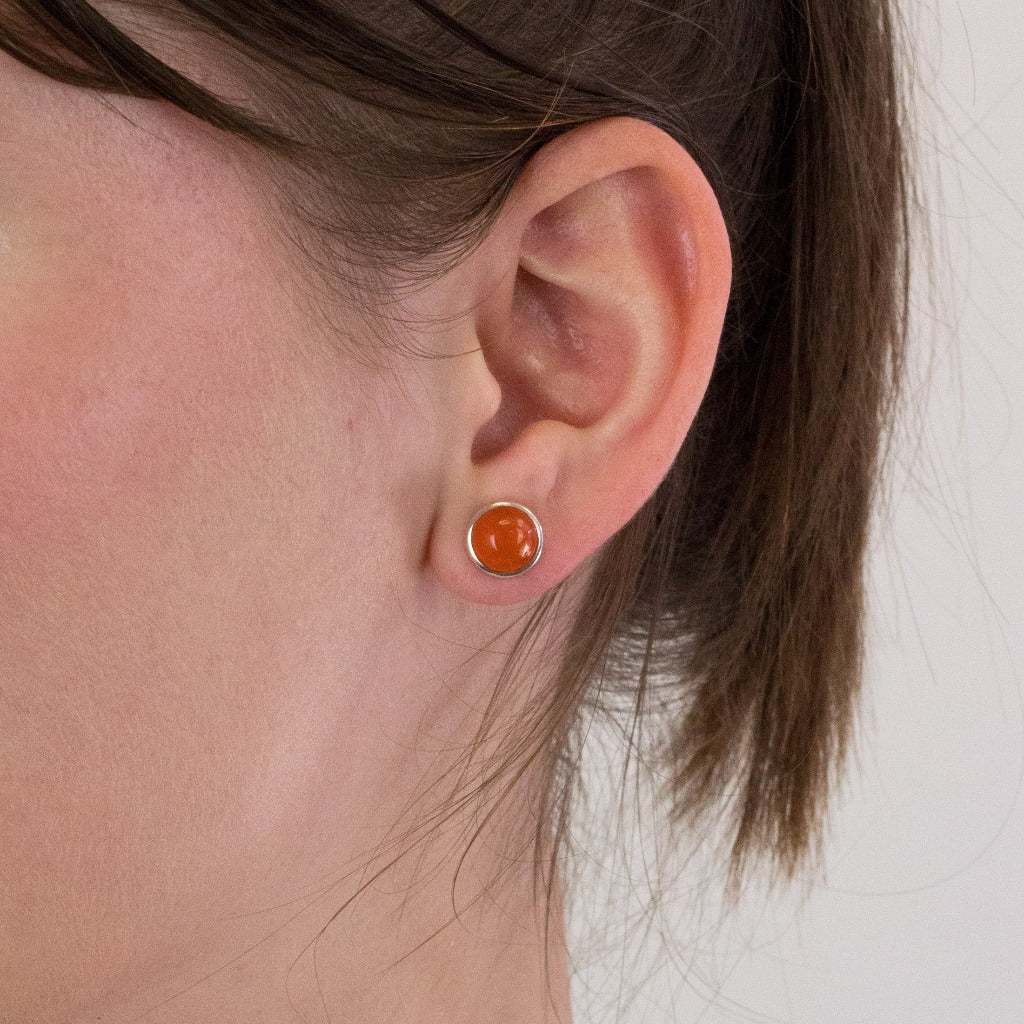 Carnelian stud earrings on model