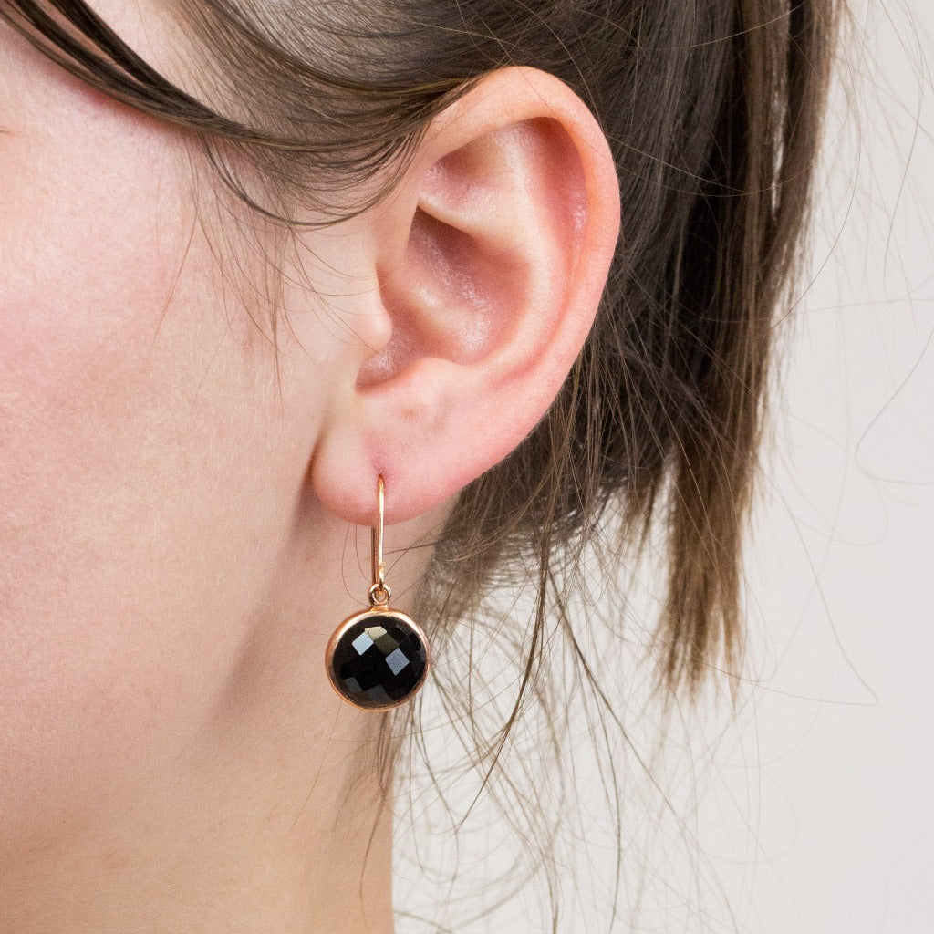 Onyx drop earrings on model