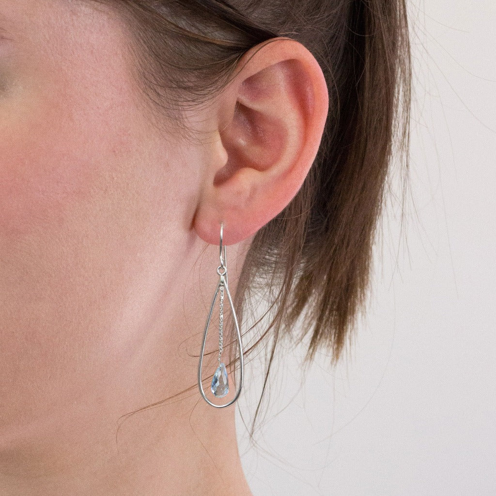 Blue Topaz drop earrings on model