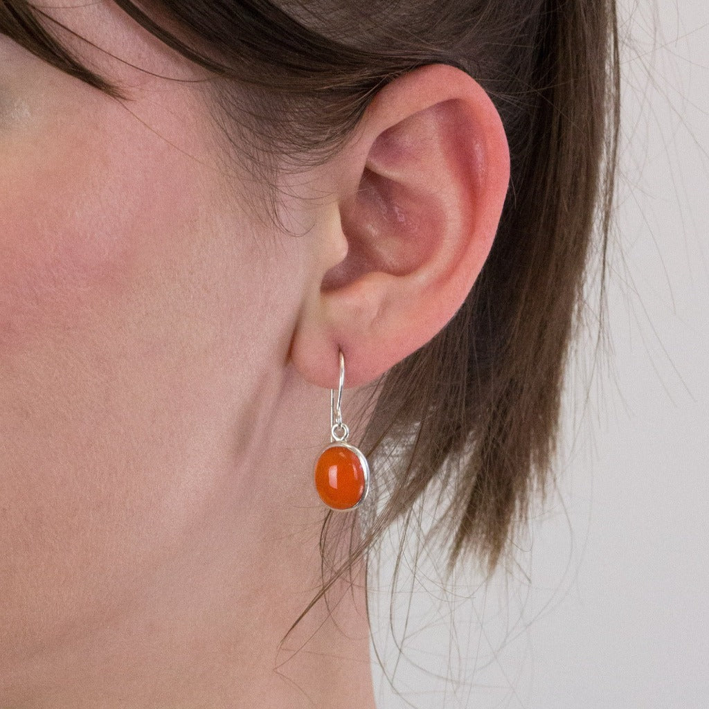 Carnelian drop earrings on model