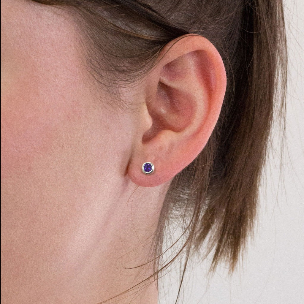 Amethyst stud earrings on model
