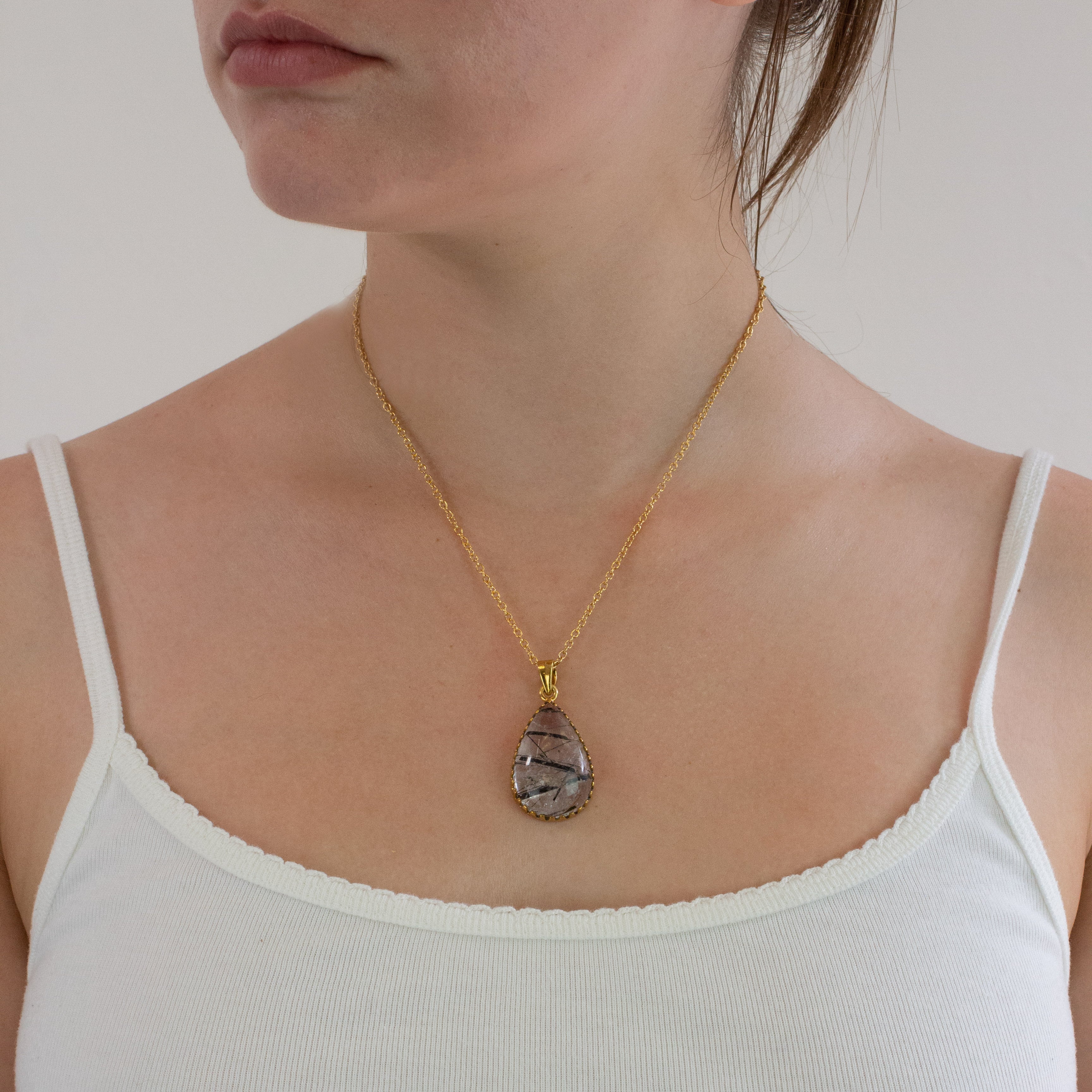 Tourmalinated quartz necklace on model