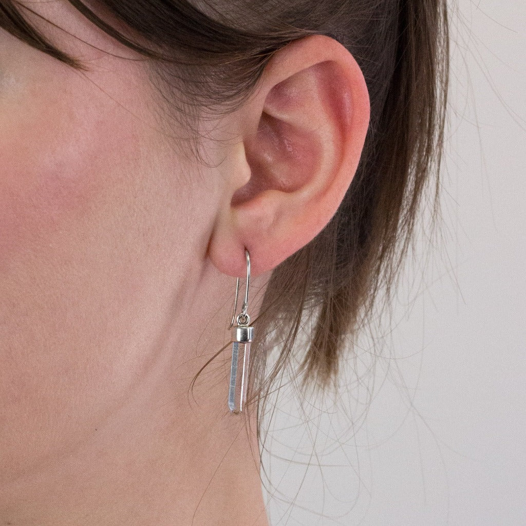 Laser Quartz drop earrings on model