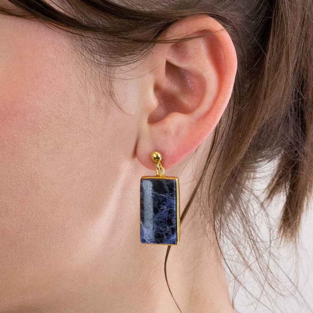 Sodalite stud drop earrings on model