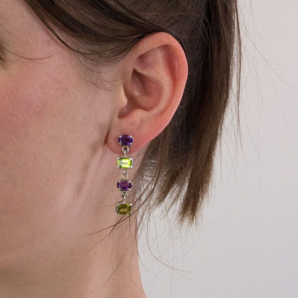 Amethyst and Peridot stud drop earrings on model