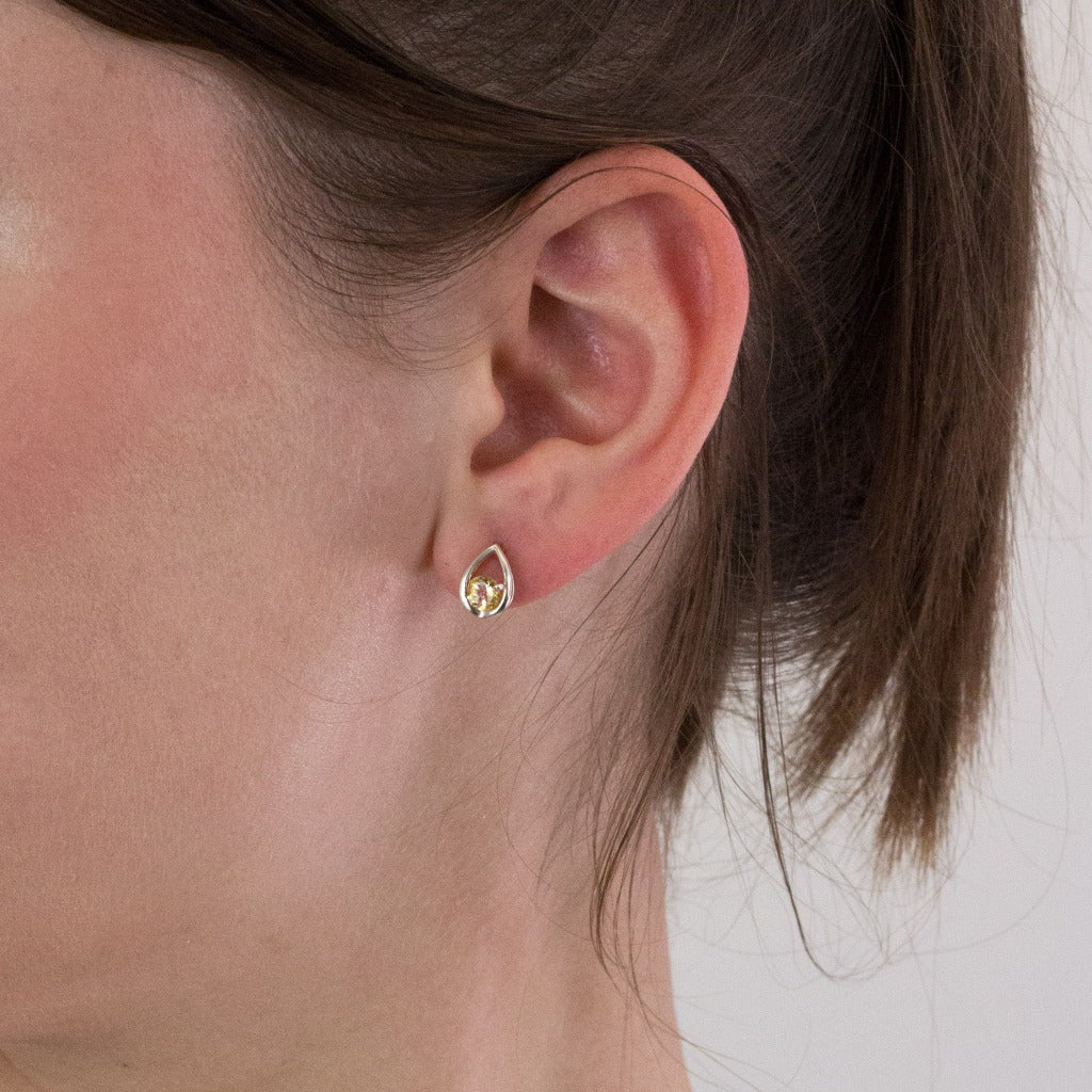 Citrine stud earrings on model