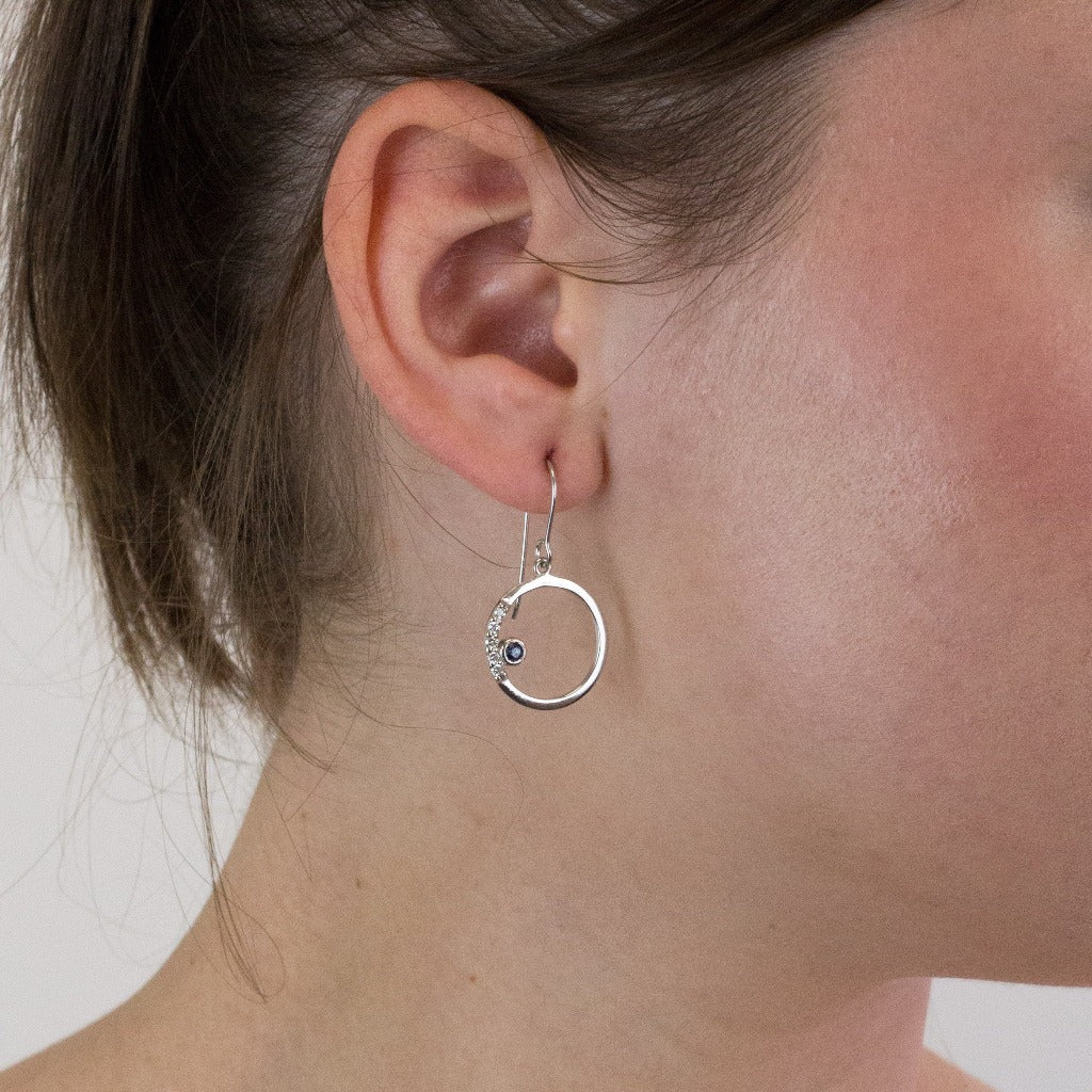 Sapphire drop earrings on model